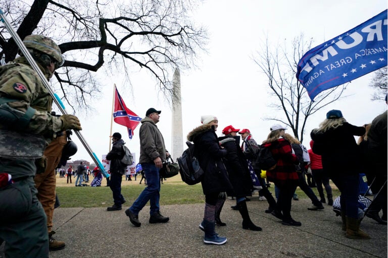 In this Jan. 6, 2021, file photo, Trump supporters gather on the Washington Monument grounds in advance of a rally in Washington. (AP Photo/Julio Cortez)