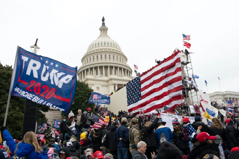 In this Jan. 6, 2021, file photo, supporters of President Donald Trump stand outside the U.S. Capitol in Washington. (AP Photo/Jose Luis Magana)