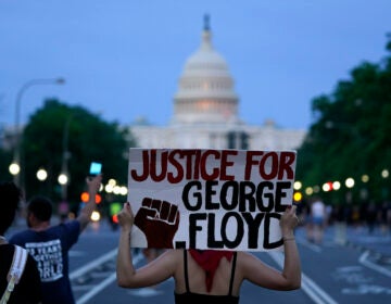 In this May 29, 2020, file photo, demonstrators walk along Pennsylvania Avenue as they protest the death of George Floyd in Washington. (AP Photo/Evan Vucci)