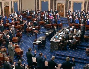 In this image from video, Sen. Patrick Leahy, D-Vt., the president pro tempore of the Senate, who is presiding over the impeachment trial of former President Donald Trump, swears in members of the Senate for the impeachment trial at the U.S. Capitol in Washington, Tuesday, Jan. 26, 2021. (Senate Television via AP)