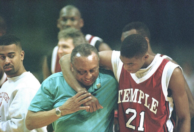 Temple University guard Eddie Jones, right, keeps basketball coach John Chaney in a headlock as they walk off the court after their practice session at the USAir Arena, Thursday, Match 17, 1994. (AP Photo/Ted Mathias)