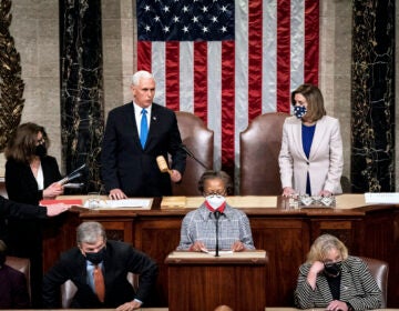 Speaker of the House Nancy Pelosi, D-Calif., and Vice President Mike Pence officiate as a joint session of the House and Senate reconvenes to confirm the Electoral College votes