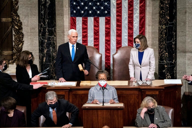 Speaker of the House Nancy Pelosi, D-Calif., and Vice President Mike Pence officiate as a joint session of the House and Senate reconvenes to confirm the Electoral College votes