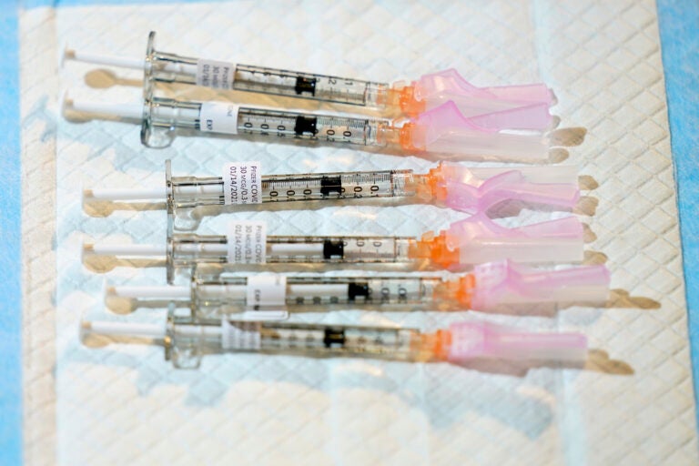 Six syringes filled with the COVID-19 vaccine are pictured in a file photo
