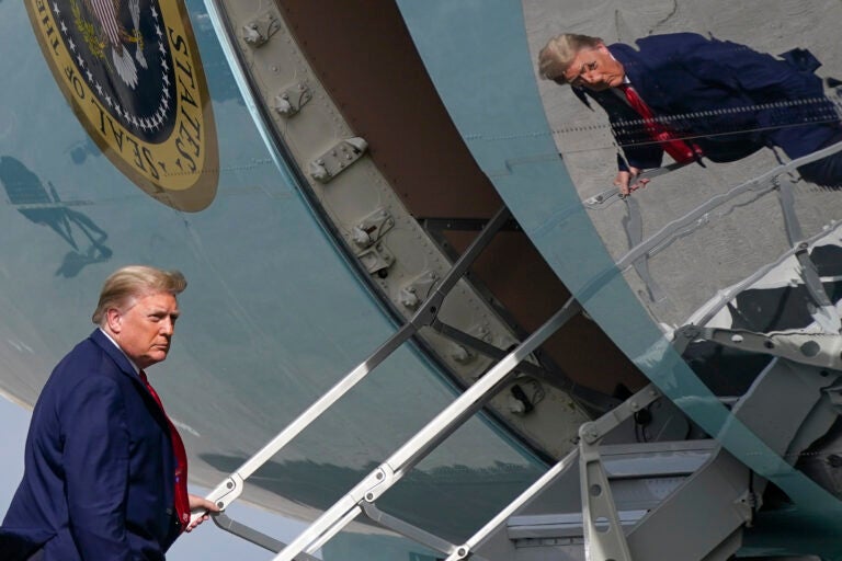 President Donald Trump boards Air Force One at Palm Beach International Airport