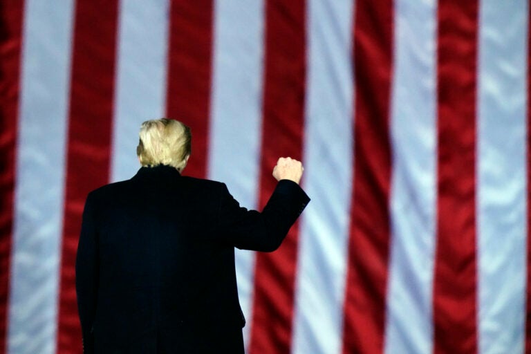 President Donald Trump gestures at a campaign rally