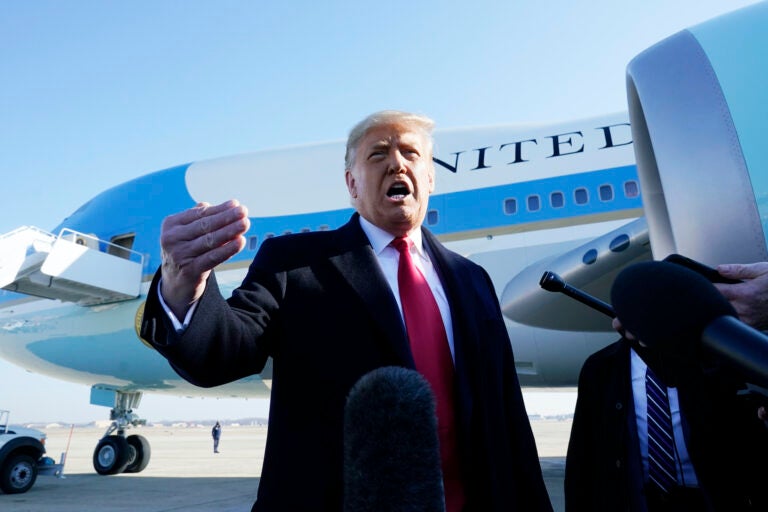 Former President Donald Trump speaks to the media before boarding Air Force One