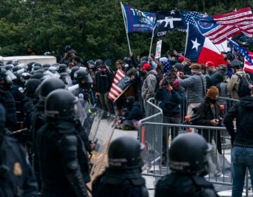 Pro-Trump insurrectionists clash with Capitol Police officers outside the Capitol