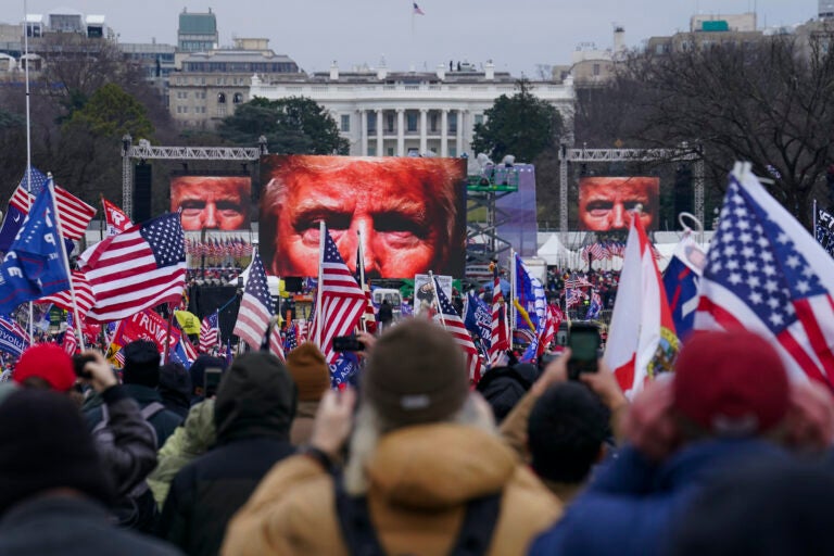 Trump supporters participate in a rally ahead of a violent insurrection at the Capitol building