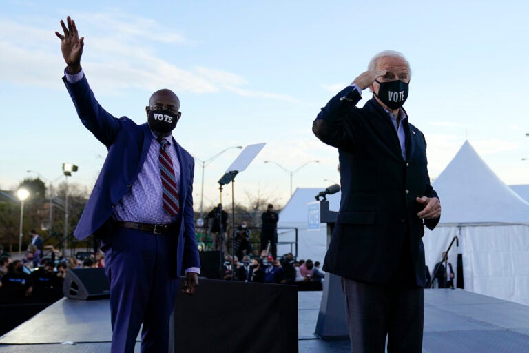 President-elect Joe Biden campaigns in Atlanta, Monday, Jan. 4, 2021, for Senate candidates Raphael Warnock, left, and Jon Ossoff