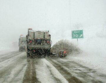 A PennDOT snowplow train works to clear I-91 during a blizzard