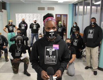 Dr Ala Stanford and the Black Doctors Consortium gather at a Philadelphia Department of Health vaccine clinic to get the first wave of COVID-19 vaccinations. (Emma Lee/WHYY)