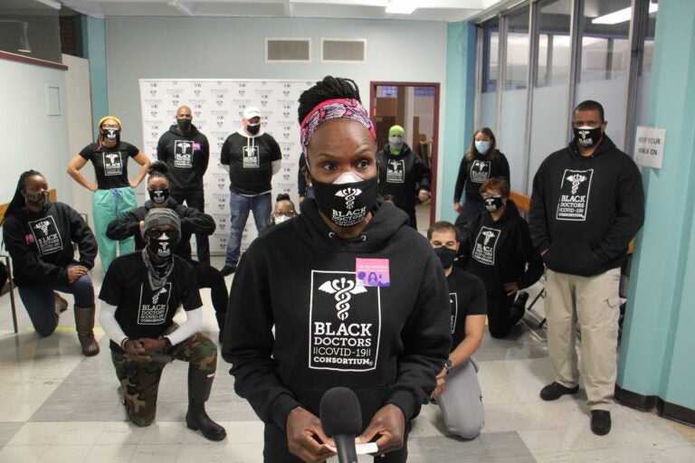 Dr Ala Stanford and the Black Doctors Consortium gather at a Philadelphia Department of Health vaccine clinic to get the first wave of COVID-19 vaccinations. (Emma Lee/WHYY)