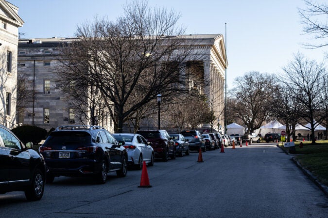 A long line of drivers wait for free COVID-19 testing at Girard College