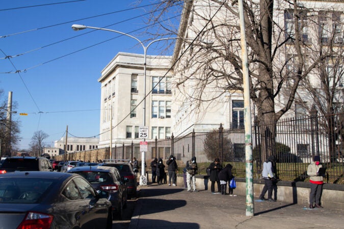 A long line of people wait to be tested for COVID-19 outside Girard College