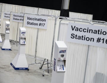 Vaccination stations at the New Jersey Convention and Exposition Center Covid-19 vaccination site in Edison, New Jersey, U.S., on Friday, Jan. 15, 2021. New Jersey will expand Covid-19 vaccinations to people 65 years old and over and those ages 16 to 64 who have 