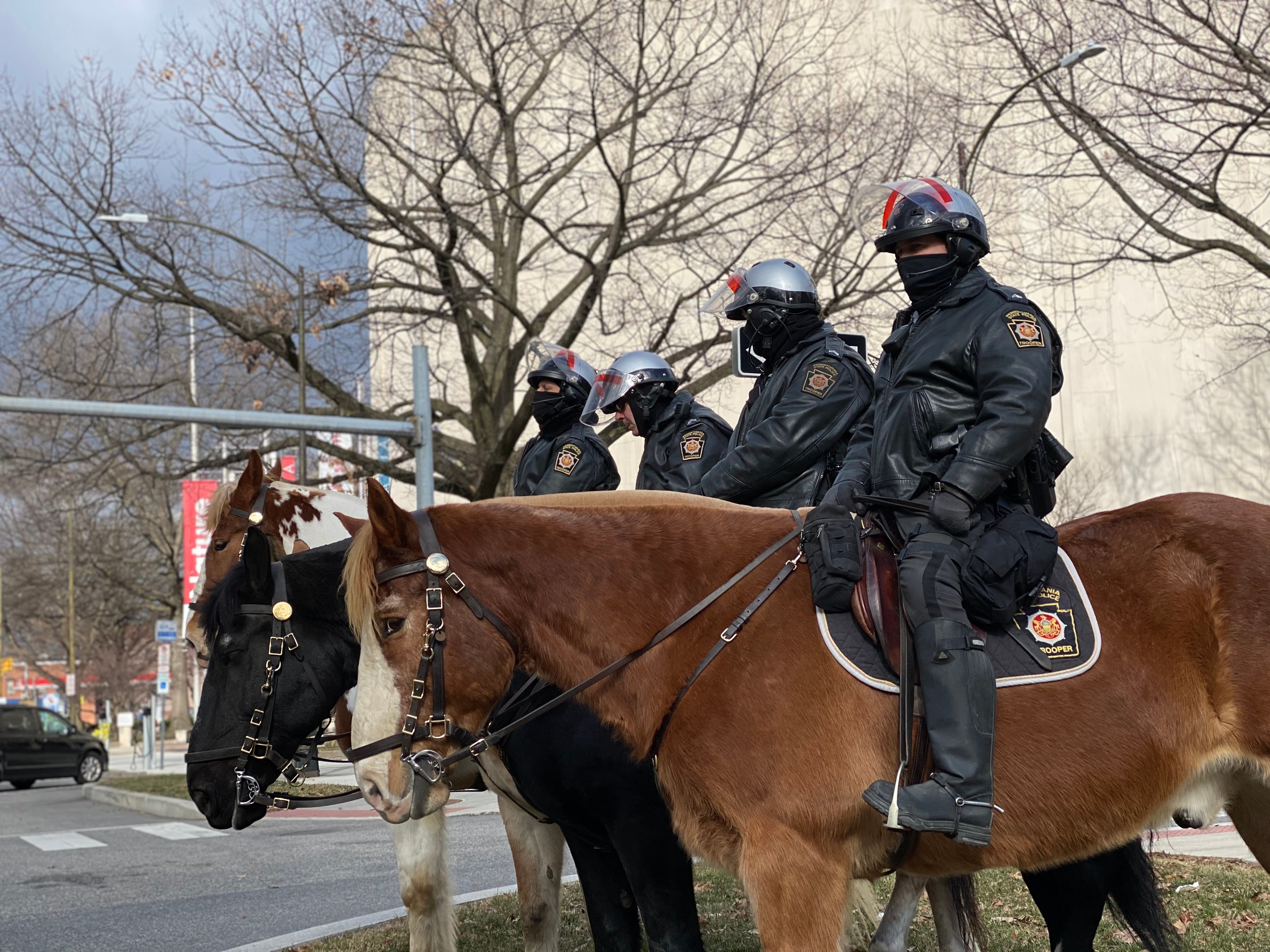 Pennsylvania State Police Troopers monitor an area near the Pa. state Capitol