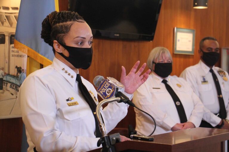 Philadelphia Police Commissioner Danielle Outlaw, wearing a face mask, speaks to the press