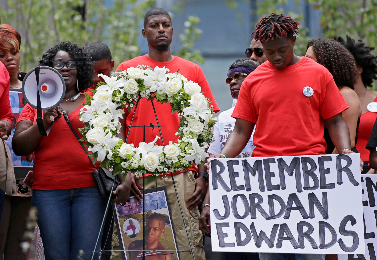 Slain teen Jordan Edwards' mother Charmaine Edwards, left, speaks to supporters with son Vidal Allen, right, and husband Odell Edwards during a protest outside the courthouse in Dallas