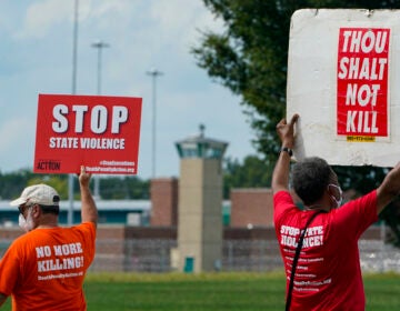 Protesters gather near the the federal prison complex in Terre Haute, Ind., on Aug. 28, 2020, ahead of the scheduled execution of Keith Dwayne Nelson, who was convicted of kidnapping, raping and murdering at 10-year-old Kansas girl. Democrats are pushing new legislation to outlaw federal executions. (Michael Conroy/AP)