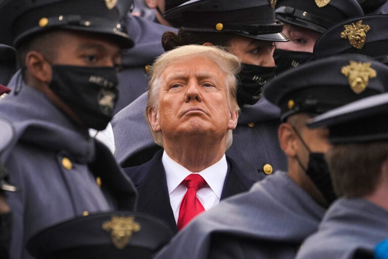 Surrounded by Army cadets, President Trump watches the Army-Navy football game