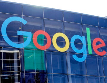 A sign is shown on a Google building at their campus in Mountain View, Calif.