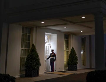 A Marine stands outside the entrance to the West Wing of the White House, signifying President Donald Trump is in the Oval Office, on Thurs., Jan. 7, 2021. (Patrick Semansky/AP Photo)