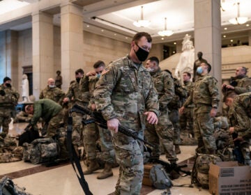 National Guard troops are inside the U.S. Capitol Visitor Center to reinforce security Wednesday at the Capitol in Washington. It comes a week after an insurrection at the Capitol. (J. Scott Applewhite/AP Photo)