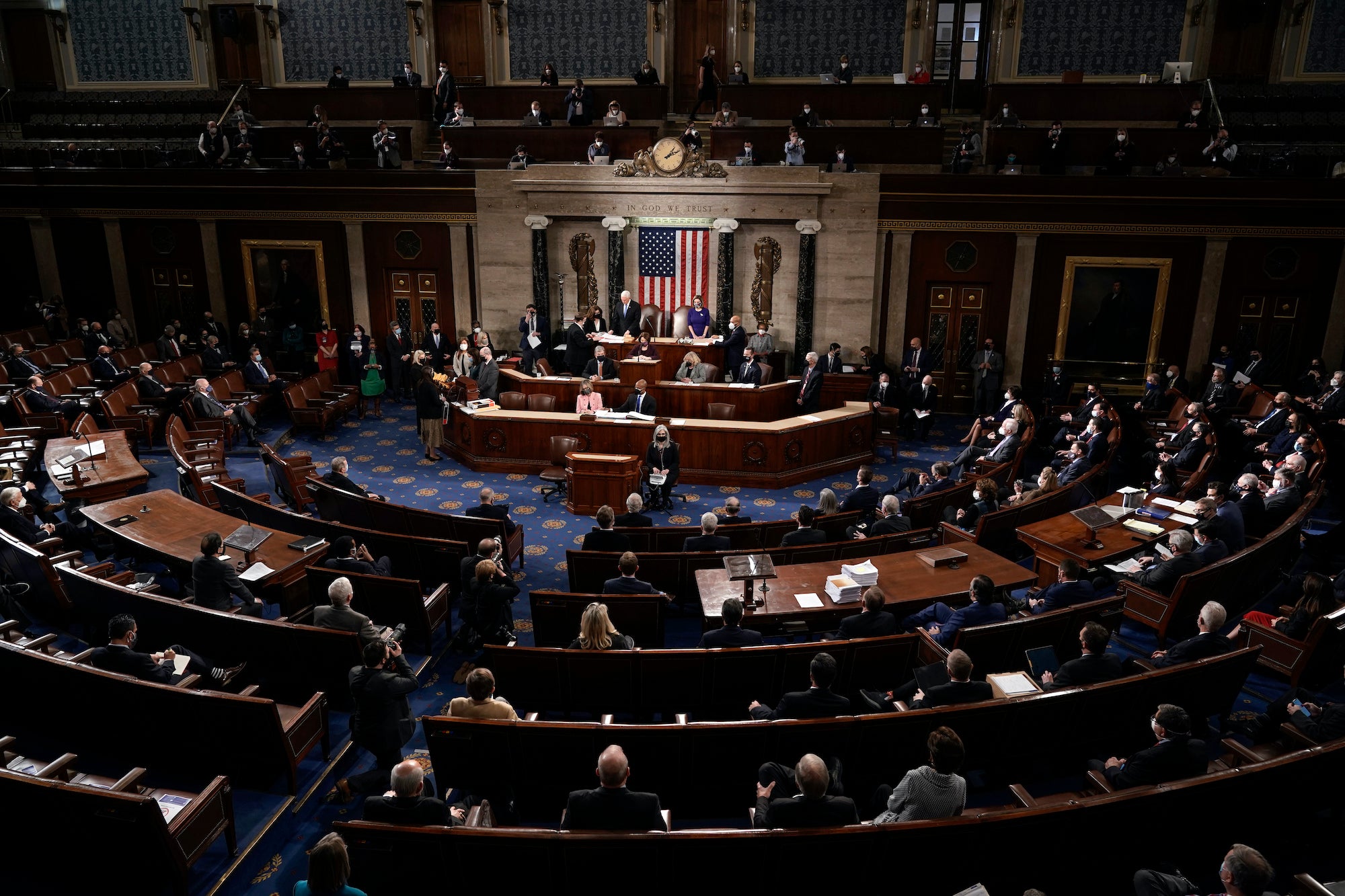 Speaker of the House Nancy Pelosi, D-Calif., and Vice President Mike Pence officiate as a joint session of the House and Senate convenes to confirm the Electoral College votes cast in November's election