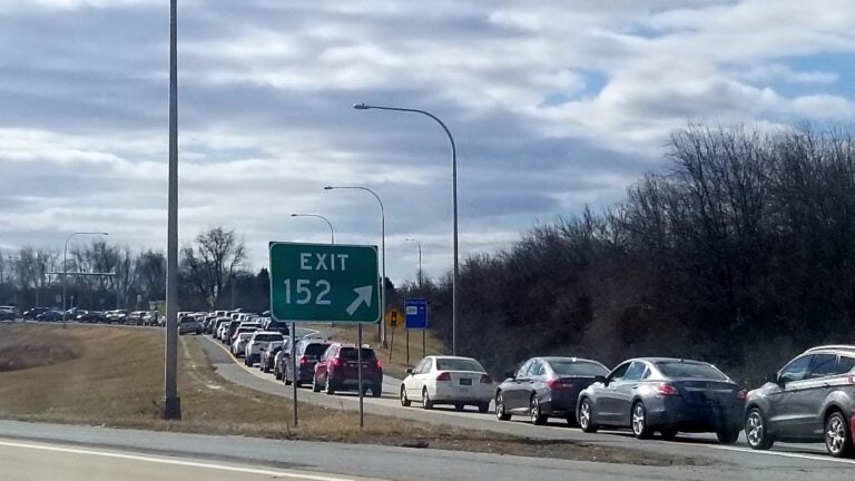 Drivers sit in traffic on the highway while waiting for COVID-19 vaccinations