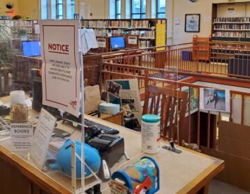 COVID-protective plexiglass barriers at a West Philly branch of the Free Library