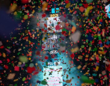 Confetti falls in front of the New York Times Square 2021 ball drop