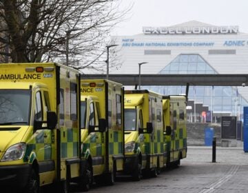 Ambulances are parked outside the NHS Nightingale hospital at the Excel centre in east London on January 1, 2021