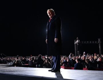 President Trump arrives at a rally in support of Republican incumbent Sens. Kelly Loeffler and David Perdue