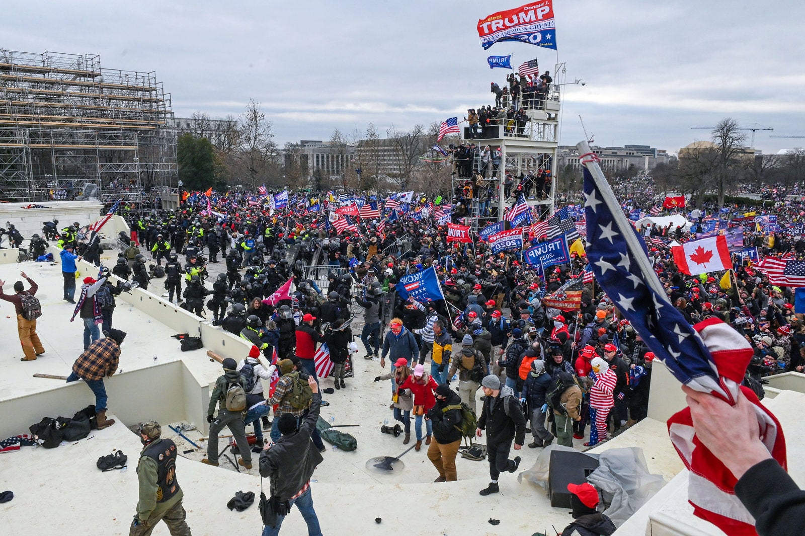 Pro-Trump extremists clash with police and security forces as they invade the Inauguration Day platform on Wednesday