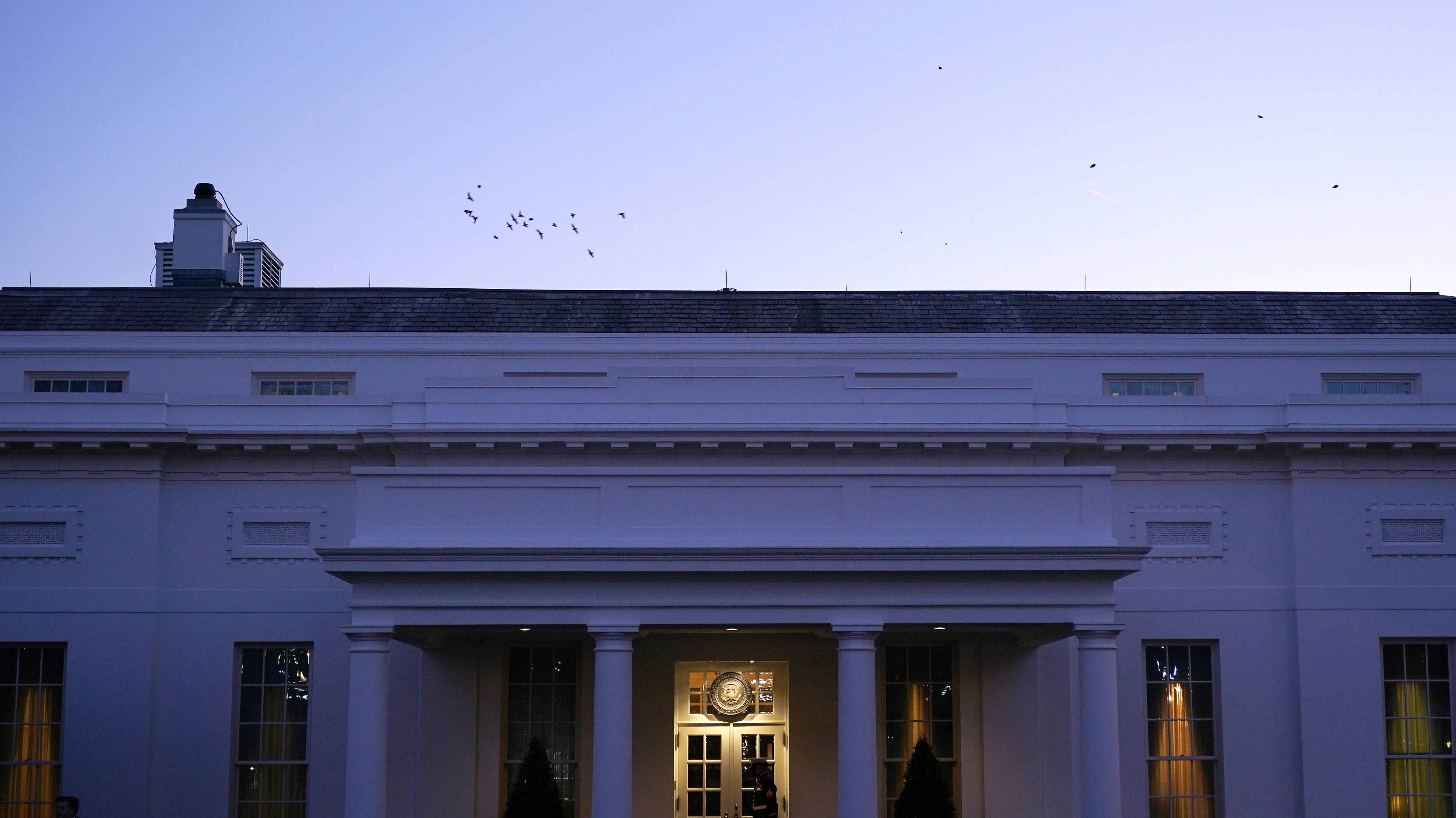A Marine Corps soldier guards the West Wing of the White House