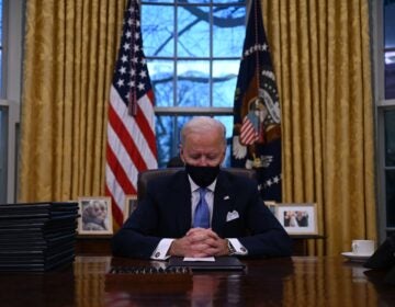 President Biden sits in the Oval Office at the White House