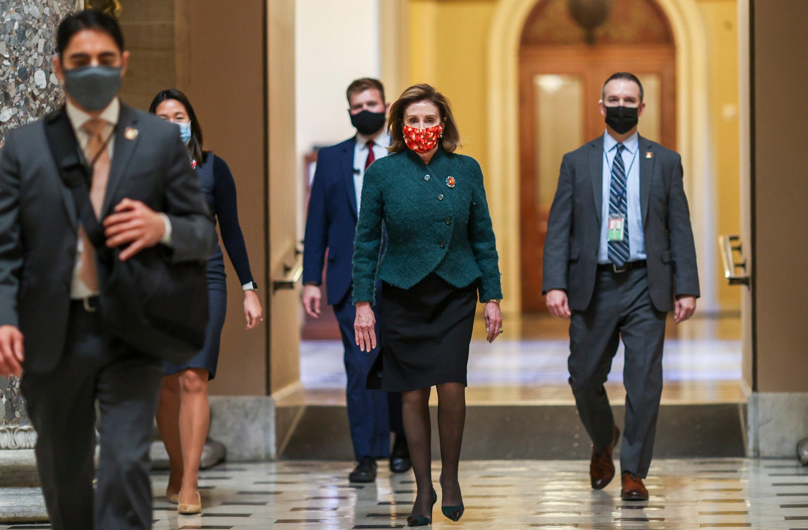 House Speaker Nancy Pelosi, D-Calif., heads back to her office after opening up the House floor on Monday