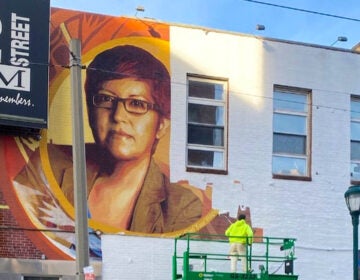 The Gloria Casarez mural as it was being erased