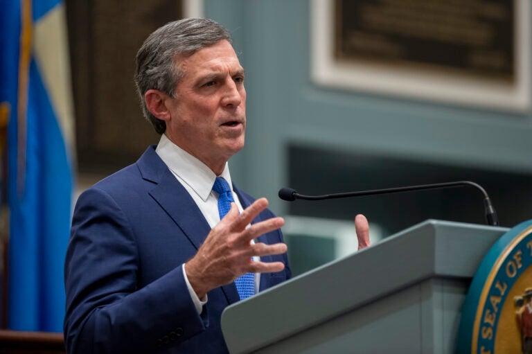 Delaware Gov. John Carney speaks at a podium