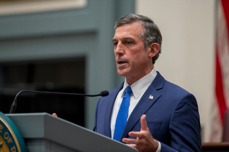 Delaware Gov. John Carney speaks at a podium