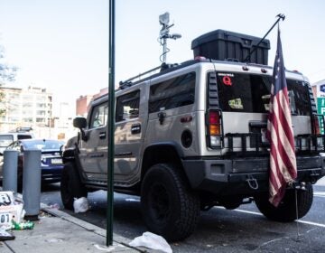 This Hummer was parked near the Pennsylvania Convention Center in November 2020. Inside, police found a semi-automatic rifle, ammunition, a lock-pick kit, among other items. (Kimberly Paynter/WHYY)