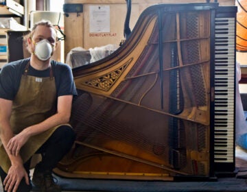 Restoration pro Tom Rudnitsky with the Frank-Bauer family piano