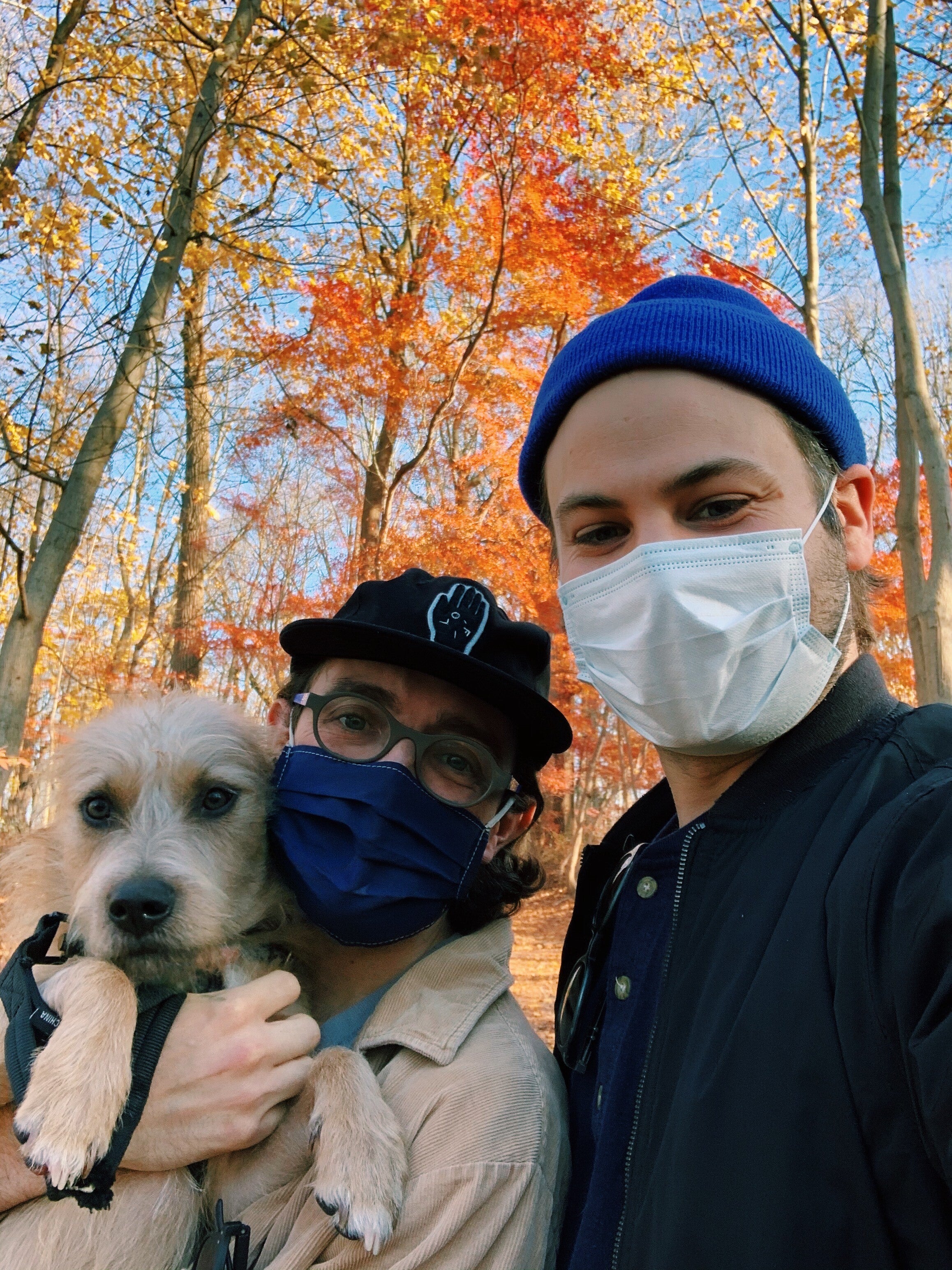 Mike Kaiser and his husband, Wade Keller, and their dog, Rooney, taking a walk at Wissahickon Valley Park.