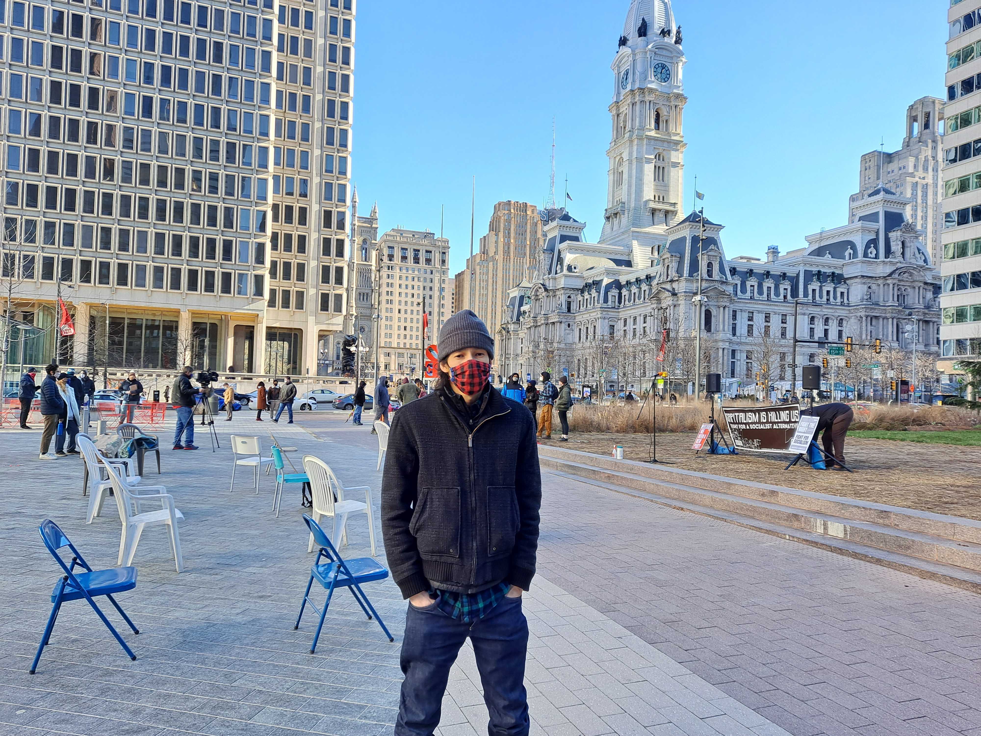 Jed Lauchroen stands outside near City Hall at a Socialist Alternative meeting