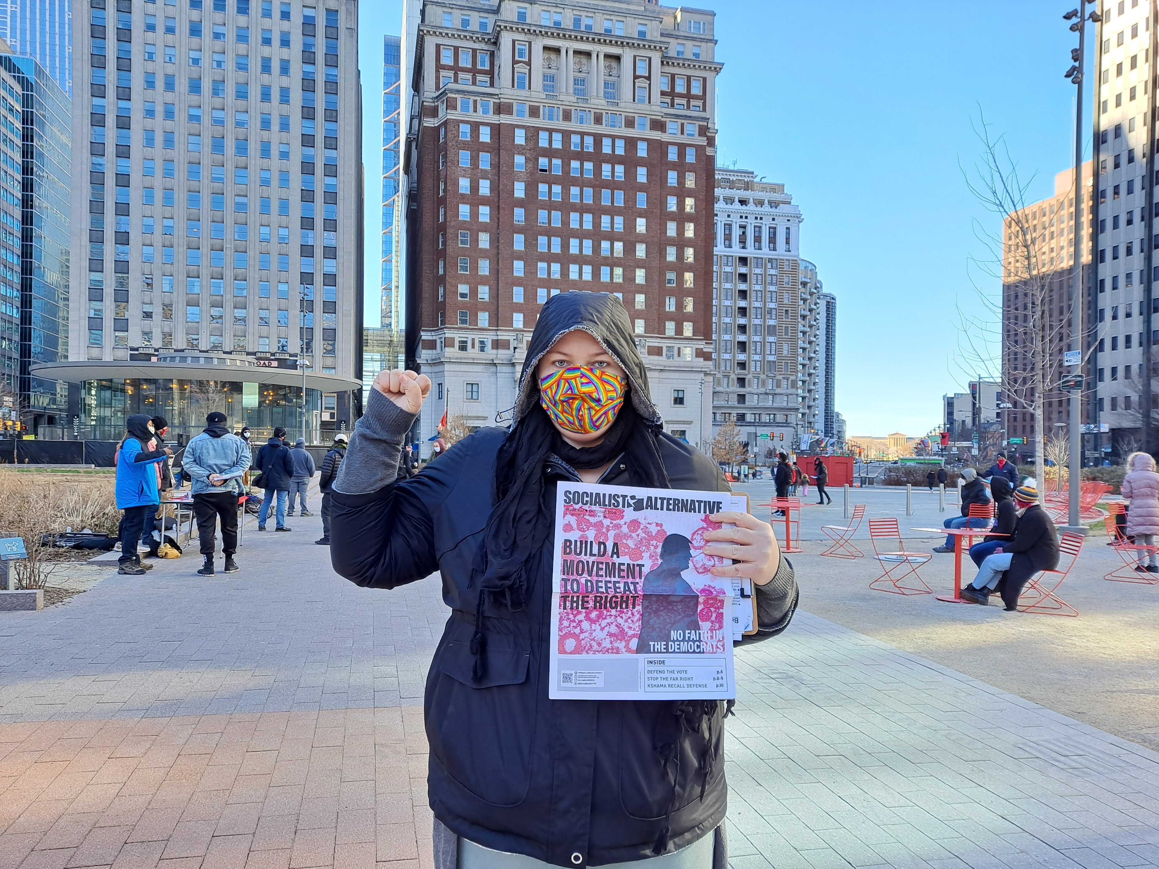 Nat Dekok stands outside near City Hall at a Socialist Alternative meeting