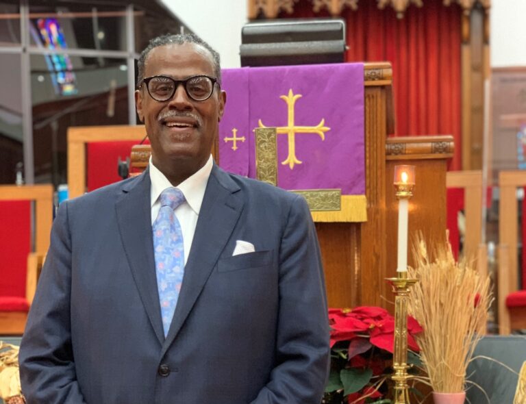 Rev. Silvester Beaman stands inside Wilmington's Bethel African Methodist Episcopal Church