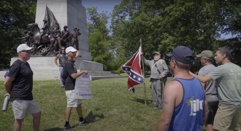 Scott Hancock speaks in front of the Virginia monument in this still from the upcoming documentary 