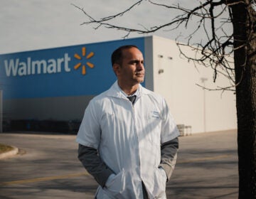 Ashwani Sheoran, 37, stands for a portrait near a Walmart in Elkton