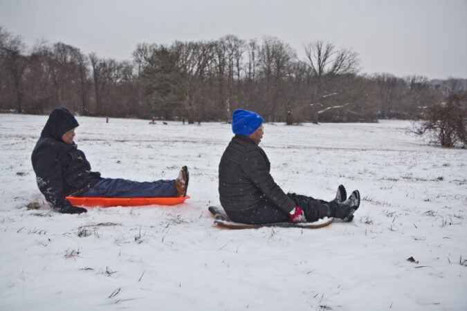 Lynn Nicholas and her husband Dennis Lee sled at Belmont Plateau